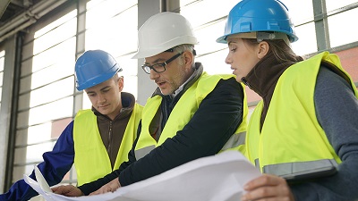 Photo of Mentor Guiding Apprentices on Job