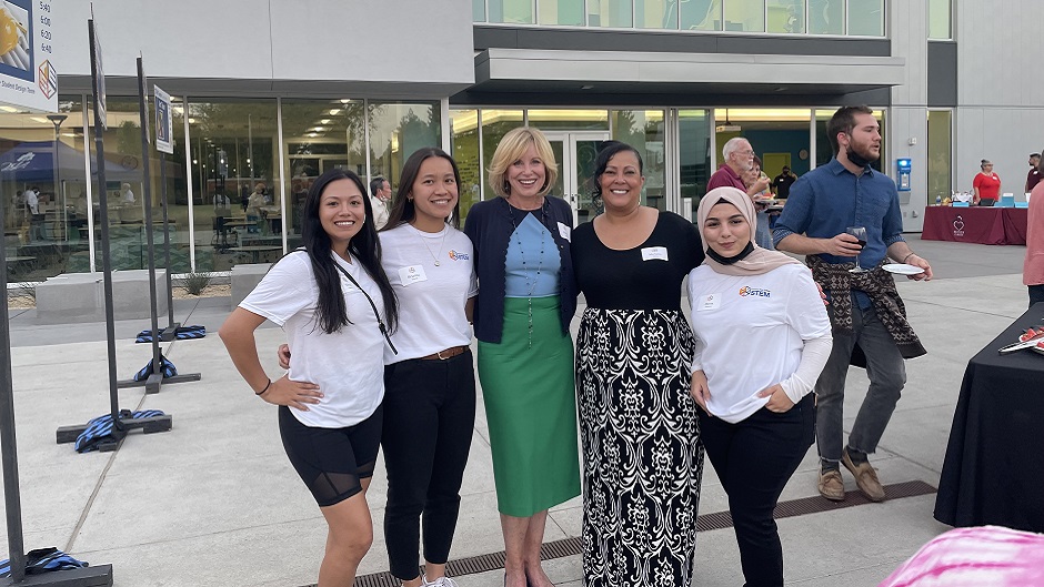 Diane Bryant posing with MESA students