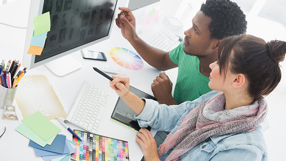 Students looking at a computer monitor