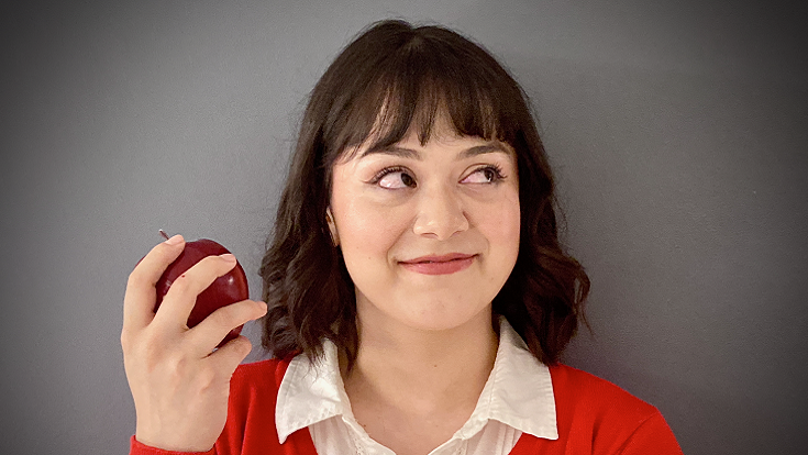 Image of a girl holding an apple