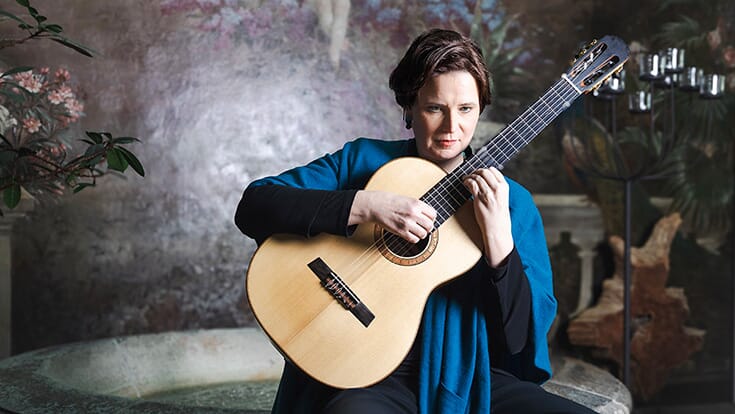 Yvonne Zehner holding a guitar